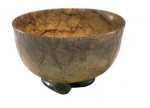 A jade bowl in the shape of lotus leaf, made in the Ming Dynasty (1368—1644) with a height of 5.3 cm and a diameter at the opening of 9.4 cm