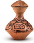 a pottery pot produced 4,500-3,000 years ago, which was unearthed at Qin’an, Gansu Province. It features a slender neck and a painted pattern resembling the face of a pig