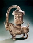 An Eastern Han dynasty copper ox lamp inlaid with silver
