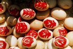 The “red egg” from the maternal family sent on the first full month of a new born, with papercut “evergreen tree” pasted on it, a folk custom along the Yangtze River
